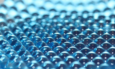 Obraz premium Water blue gel balls. Polymer gel. Silica gel. Balls of blue hydrogel. Crystal liquid ball with reflection. Texture background. Close up macro