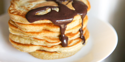 Breakfast, homemade classic american pancakes with chocolate syrup