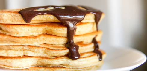 Breakfast, homemade classic american pancakes with chocolate syrup