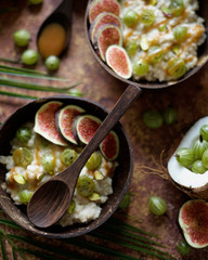 Oat flakes with coconut, gooseberry berries, caramel sauce and figs. Asian style