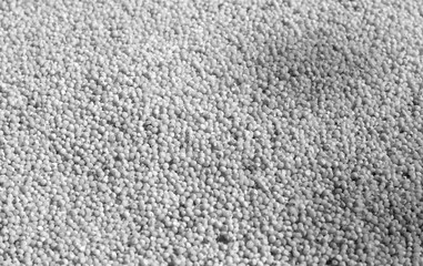 Millet groats close-up with blur effect in black and white.