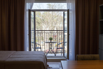 balcony with wrought-iron furniture in the apartment