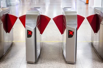Fotobehang Automatic ticket gate in the rail station close up. © DG PhotoStock