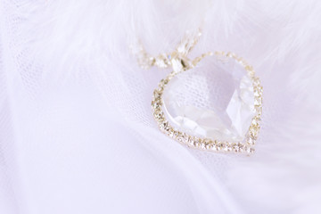 Crystal heart on a white background. Wedding background