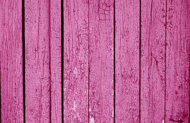 Old grungy wooden planks background in pink color.