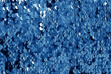 Glittering sequin texture in navy blue tone.