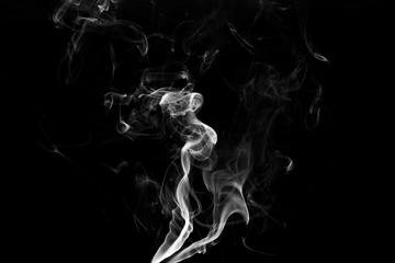 white smoke flame on a black background