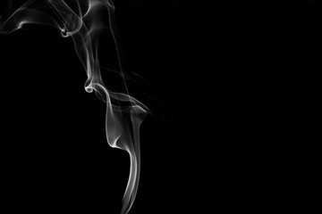 white smoke flame on a black background