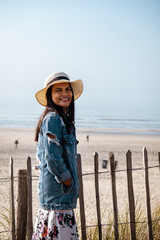woman with hat on the beach by Zandvoort Netherlands