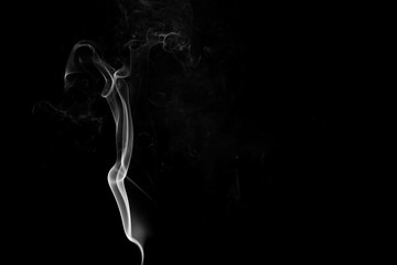 white smoke flame on a black background