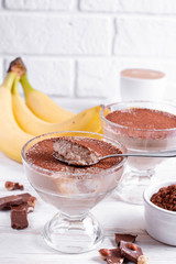 Organic homemade sweet milk dessert with banana and coffee