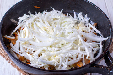 Peking cabbage with vegetables in a pan