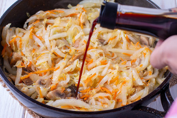 Peking cabbage with vegetables in a pan
