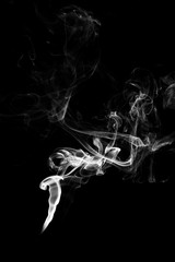 white smoke flame on a black background