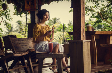 The girl in the cafe in Ubud. Bali trip. Girl with fresh. Travel.