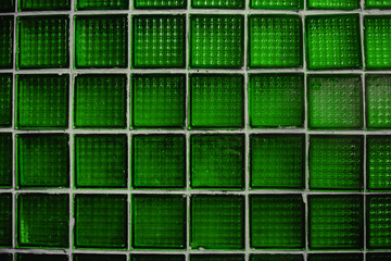 wall from an old curve of green glass tiles