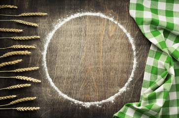 wheat flour on wooden background