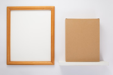 Fototapeta premium cardboard box on wooden shelf