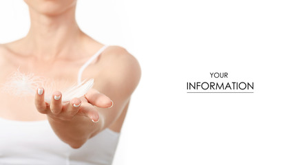 Beautiful woman in hands a feather beauty care body pattern on white background isolation