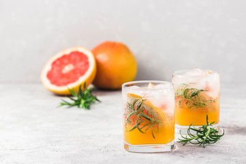 summer refreshing drinks, grapefruit rosemary cocktail. Selective focus, space for text.