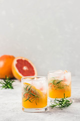 summer refreshing drinks, grapefruit rosemary cocktail. Selective focus, space for text.