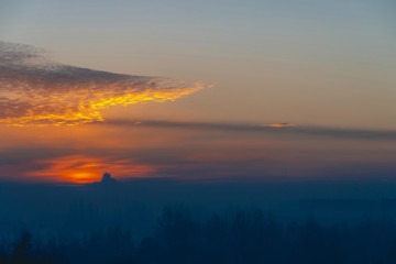 Sunny shine on clouds. Wonderful vivid dawn. Beautiful calm sunset. Scenic tranquil sunrise. Amazing peaceful cloudy sky. Sun above horizon. Picturesque sundown. Atmospheric cloudscape. Background.