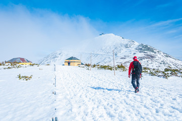 Fototapeta na wymiar Winter trail - tourist on the trail, Karkonosze, krkonose, Mount Snezka