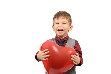 Boy holding a heart shaped balloon