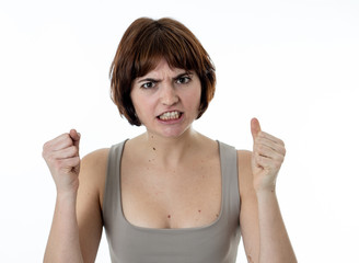 Portrait of a beautiful young woman with angry face looking furious. Human expressions and emotions