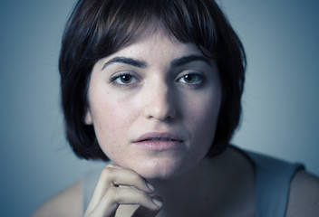 Beautiful headshot portrait of young attractive woman with stylish short hair and sensual look