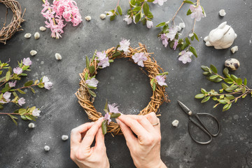 Spring wreath with flowers. Creative flat lay. View from above.