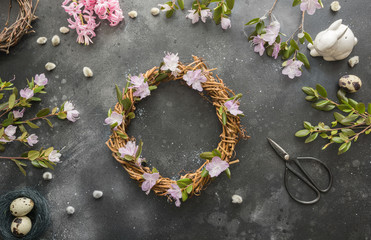 Spring wreath with flowers. Creative flat lay. View from above.