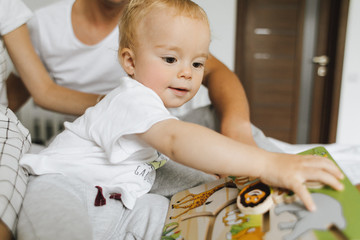 The little boy is playing a toy