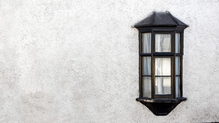 Exterior View of a Beautiful Old English Stone Cottage with window