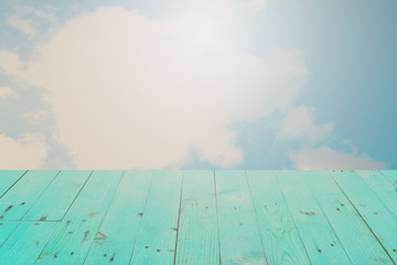 The blur cool blue sky white cloud with old Wooden table