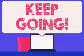 Text sign showing Keep Going. Business photo showcasing make effort to live normally in spite of difficulty situation Blank Huge Speech Bubble Pointing to White Laptop Screen in Workspace Idea