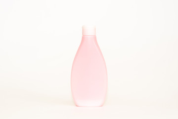 Spa or bathroom concept. Shampoo, cream, soaps, towels and pine cones on a white background.