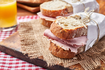 Gourmet Sandwich with Ham and orange juice