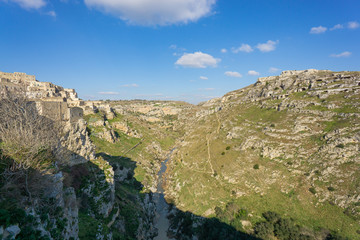 Fototapeta na wymiar View of the Gravina river's canyon in the Sassi of Matera, the underground city, the ancient town, Basilicata, southern Italy.