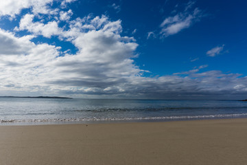 waves in the ocean and blue sky