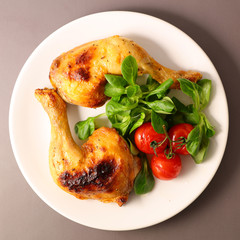 grilled chicken leg and salad
