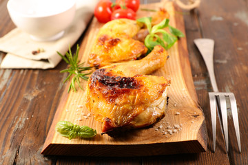 grilled chicken on wooden board
