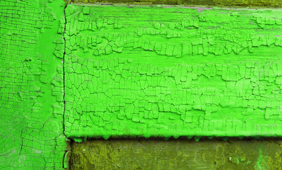 Old wooden background with remains of pieces of scraps of old paint on wood. Texture of an old tree, vintage wood background peeling paint. old blue board with cracked paint