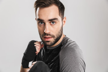 Sports fitness man boxer isolate over white wall background make exercises.