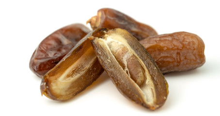 Dried of sweet dates palm fruits on white background. Dates is a dried fruit that provides high energy.
