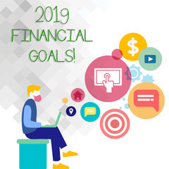 Fototapeta na wymiar Text sign showing 2019 Financial Goals. Business photo showcasing New business strategy earn more profits less investment Man Sitting Down with Laptop on his Lap and SEO Driver Icons on Blank Space