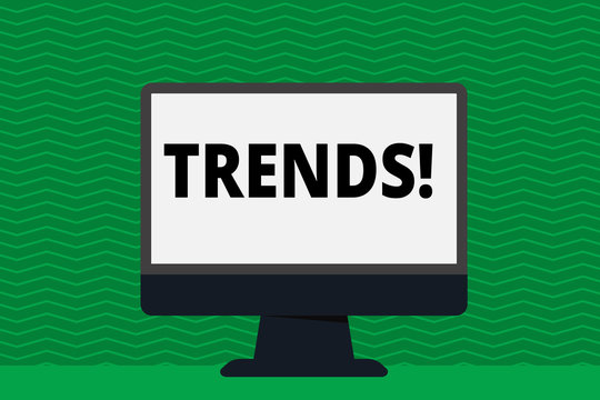 Writing note showing Trends. Business concept for General projected directions of something according to time Blank Desktop Computer Colorful Screen Freestanding on Table