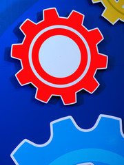 Large cog wheels engine gear wheels blue background, industrial background