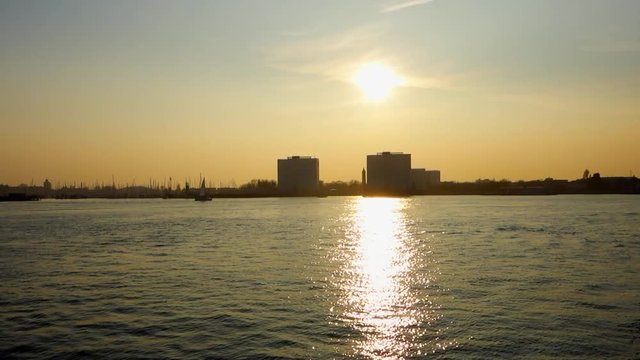 The sun sits low in the sky over Gosport as seen from Portsmouth