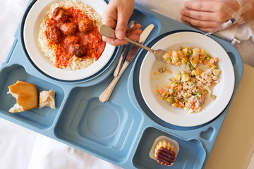 woman patient resting in hospital and  eating in bed , sick operated woman